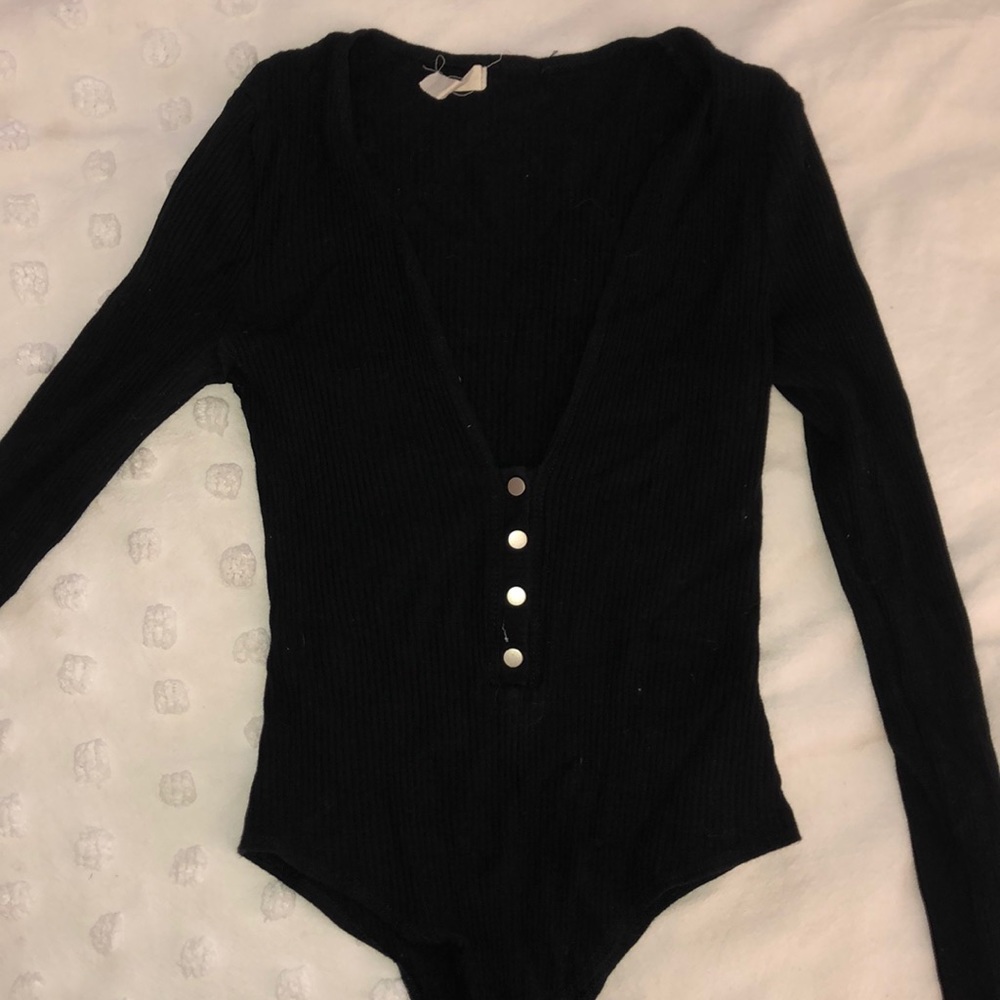 Black, low cut, button up body suit